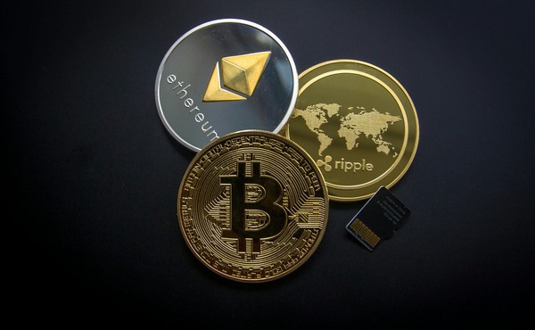 Team reviewing cryptocurrency exchange data on a laptop
